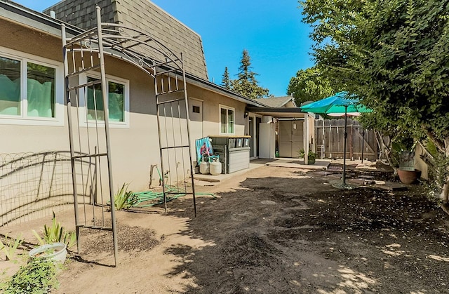 exterior space featuring a storage unit