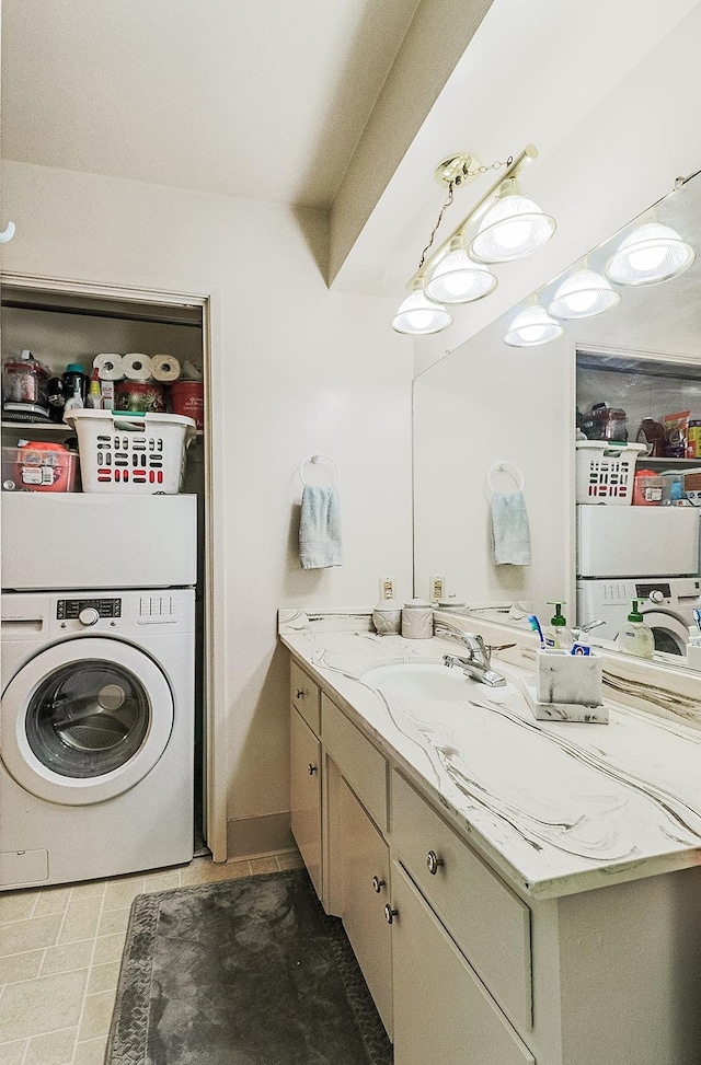 bathroom with washer / clothes dryer and vanity