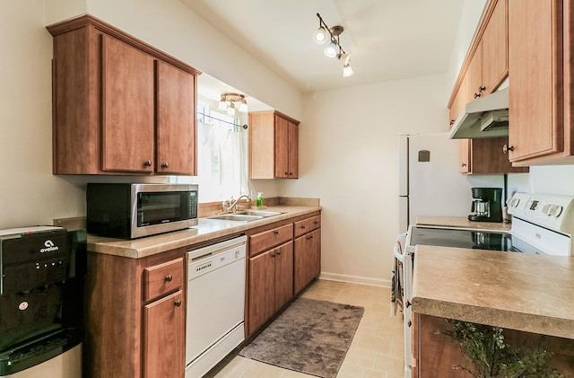 kitchen with white appliances and sink