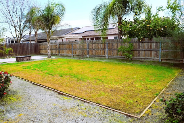 view of yard featuring a fire pit