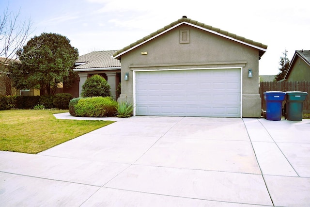 view of front of house featuring a front yard and a garage