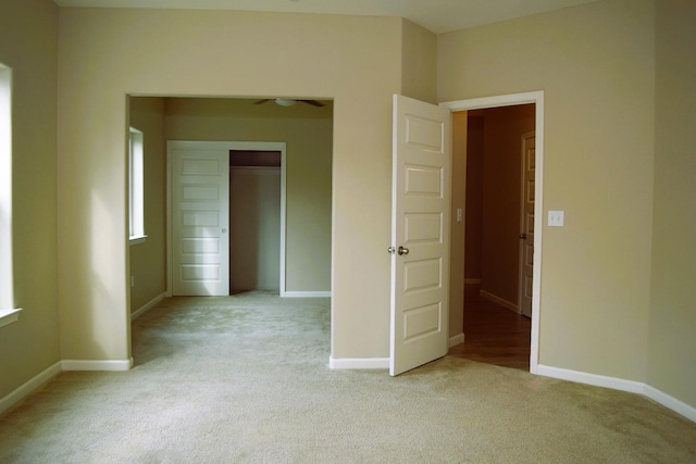 spare room with a healthy amount of sunlight and light colored carpet