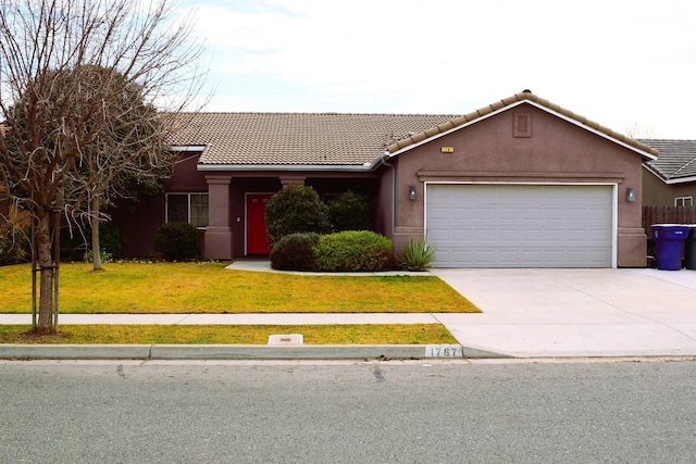 ranch-style home with a garage and a front lawn