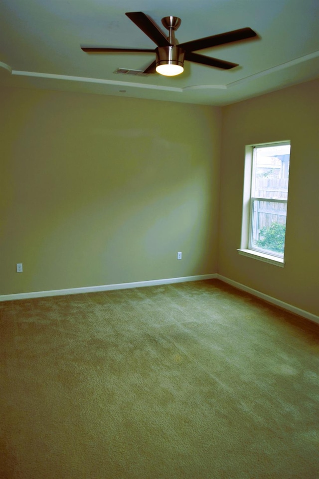 carpeted empty room with ceiling fan