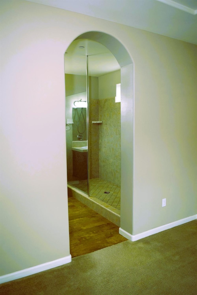 bathroom with tiled shower