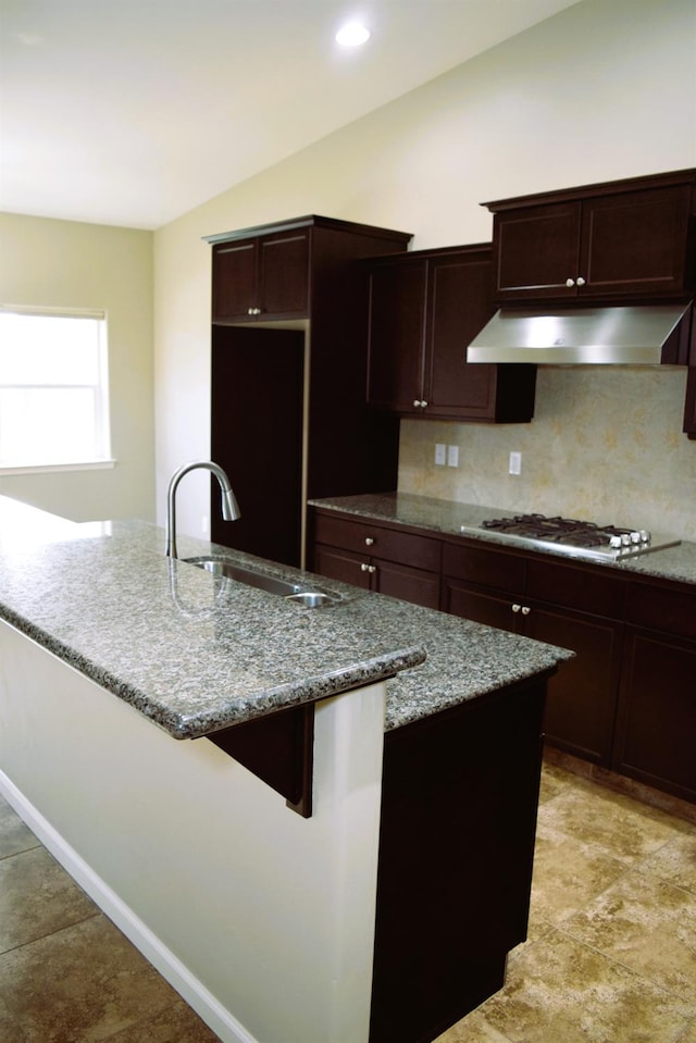 kitchen featuring sink, tasteful backsplash, white gas cooktop, light stone counters, and extractor fan