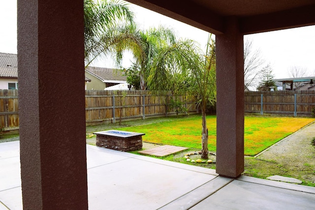 view of patio / terrace with a fire pit