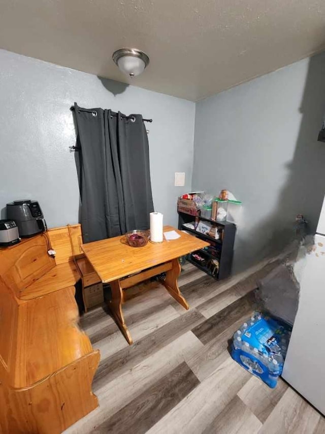 dining room with hardwood / wood-style flooring