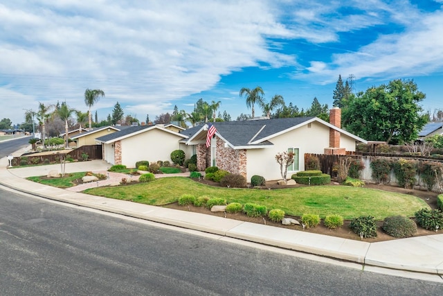 single story home with a front lawn