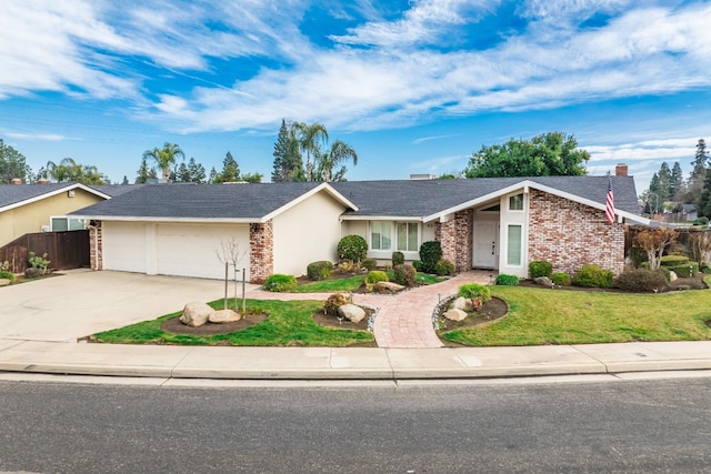 ranch-style house featuring a front yard and a garage