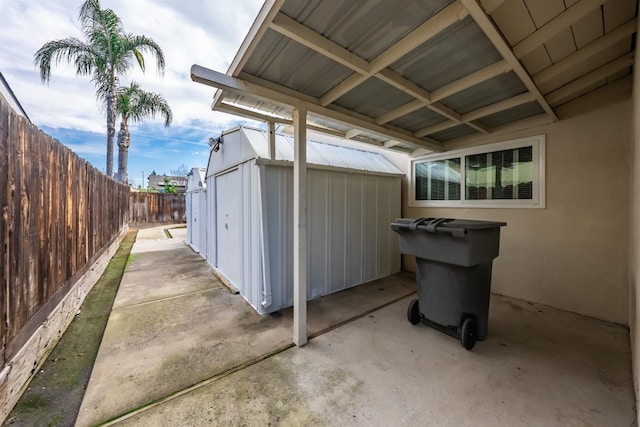 view of patio / terrace featuring a storage shed