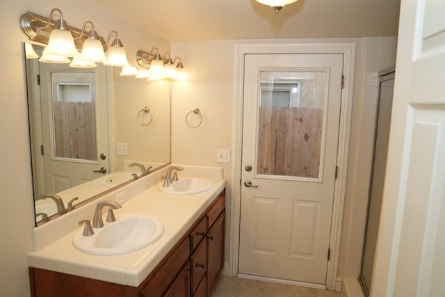 bathroom featuring tile patterned floors and vanity