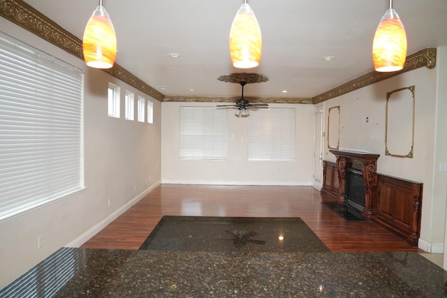 living room featuring dark hardwood / wood-style floors and ceiling fan