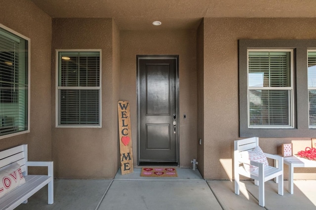 property entrance with covered porch