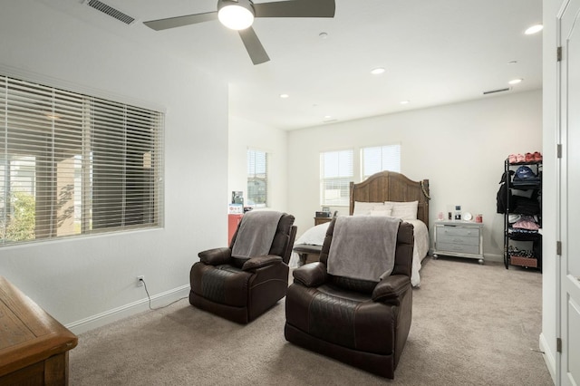 bedroom with light colored carpet and ceiling fan