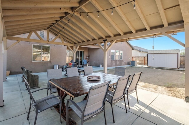 view of patio / terrace featuring a storage shed