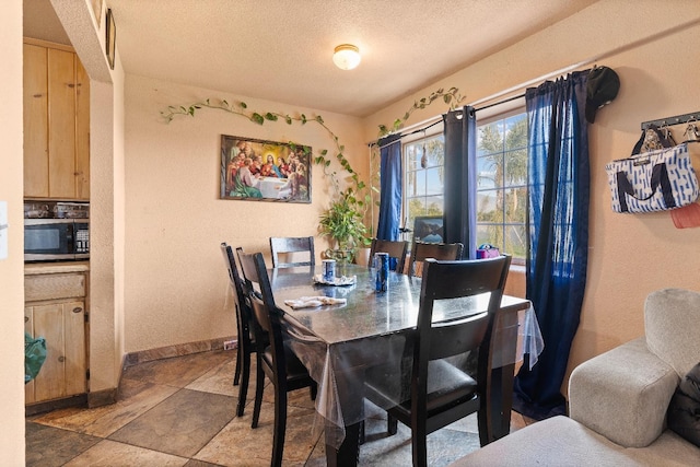 dining area with a textured ceiling