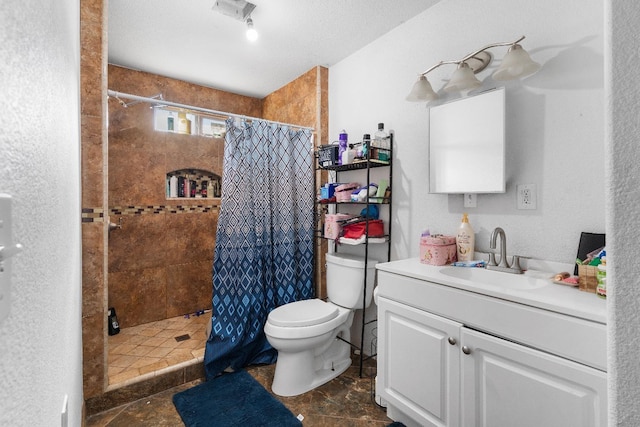 bathroom featuring a shower with curtain, vanity, and toilet