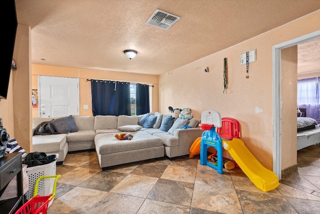 living room featuring a textured ceiling