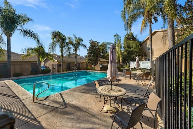 view of pool featuring a patio