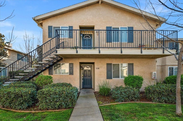 view of front of house featuring a balcony