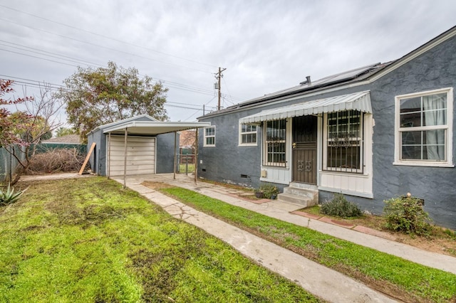 view of front of house with a shed and a front yard