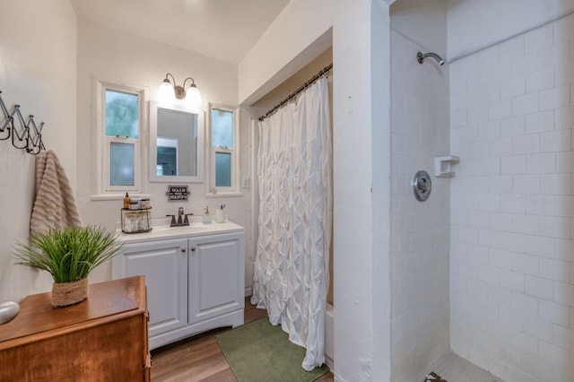 bathroom with hardwood / wood-style floors and vanity