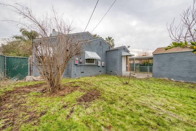 rear view of property with a yard