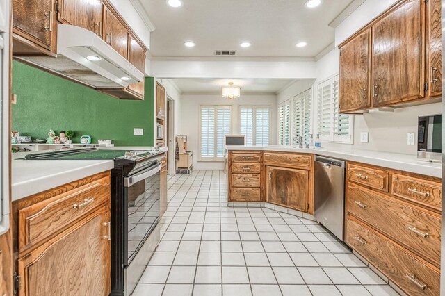 kitchen with crown molding, ventilation hood, stainless steel appliances, and light tile patterned flooring