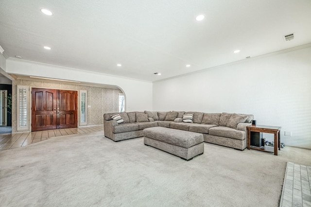 living room featuring light colored carpet and ornamental molding