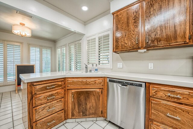 kitchen with sink, stainless steel dishwasher, kitchen peninsula, and a healthy amount of sunlight