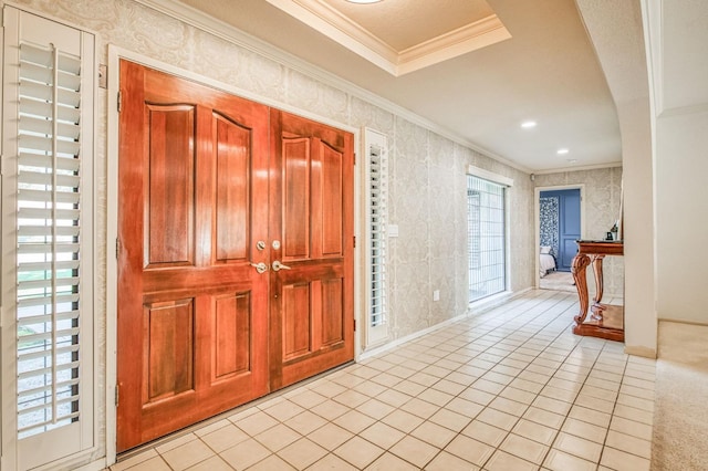 tiled entryway featuring ornamental molding