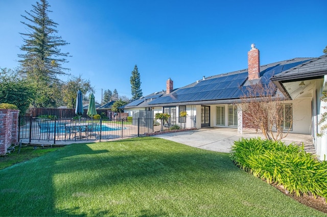 view of yard featuring a patio area and a fenced in pool