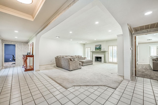 unfurnished living room with light carpet and crown molding