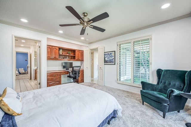 carpeted bedroom with ceiling fan and ornamental molding