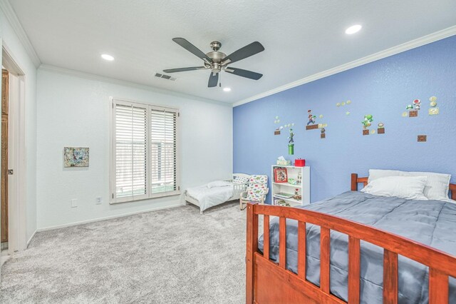 bedroom featuring ceiling fan, carpet, and crown molding