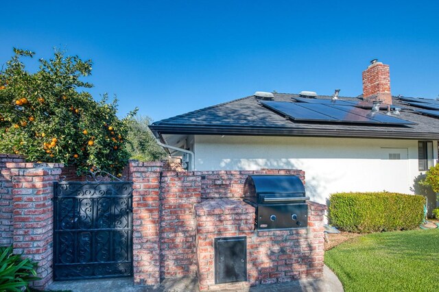 view of property exterior featuring solar panels