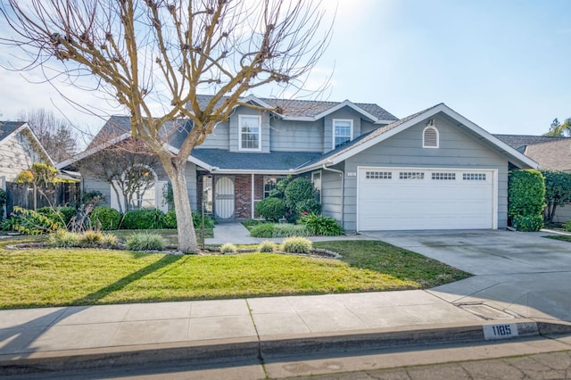 view of front of home featuring a garage and a front lawn