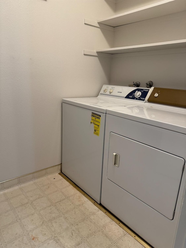 clothes washing area with independent washer and dryer