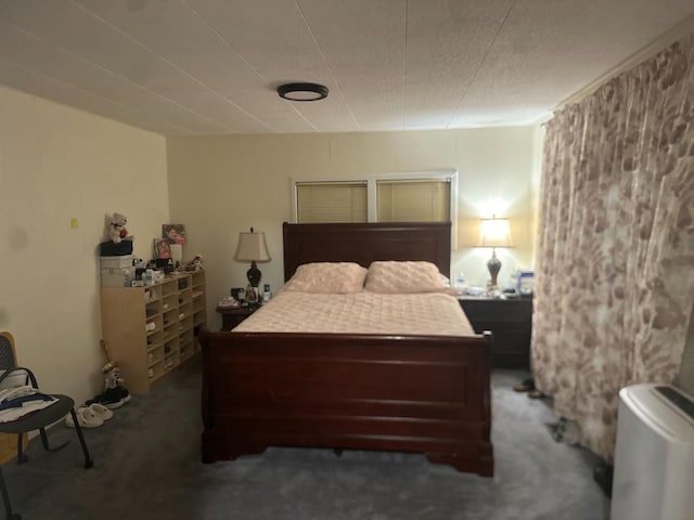 bedroom featuring dark colored carpet