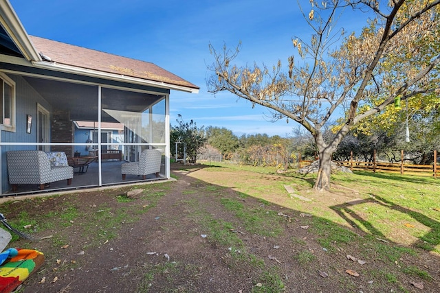 view of yard with a sunroom