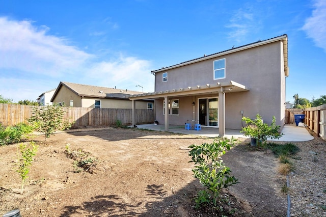 back of house with a patio area