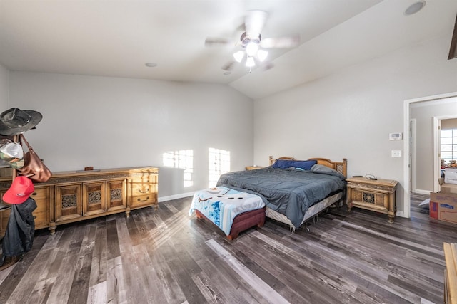 bedroom with vaulted ceiling, ceiling fan, and dark hardwood / wood-style floors