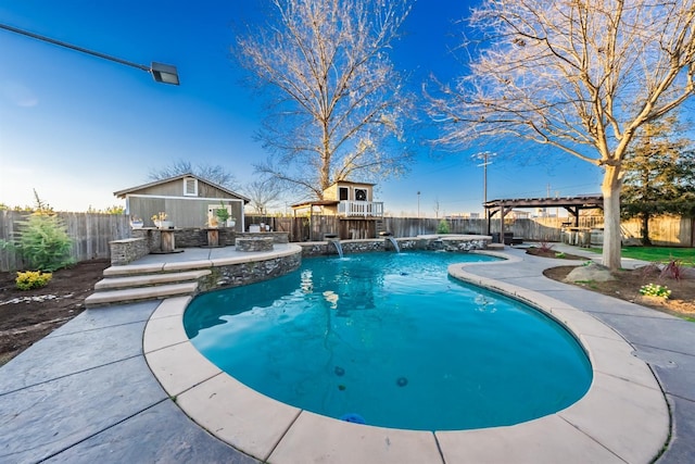 view of swimming pool with pool water feature and exterior bar