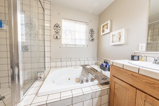 bathroom with vanity and independent shower and bath