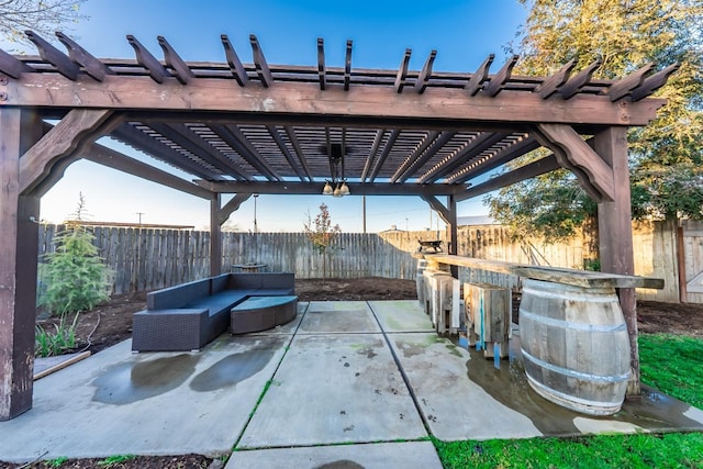 view of patio featuring a pergola, an outdoor living space, and exterior bar