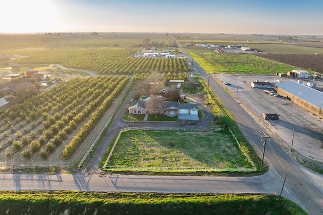 birds eye view of property with a rural view