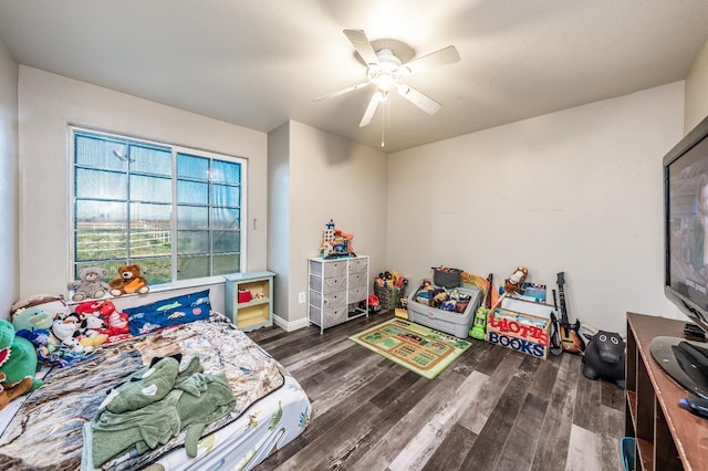 bedroom featuring ceiling fan and dark hardwood / wood-style floors