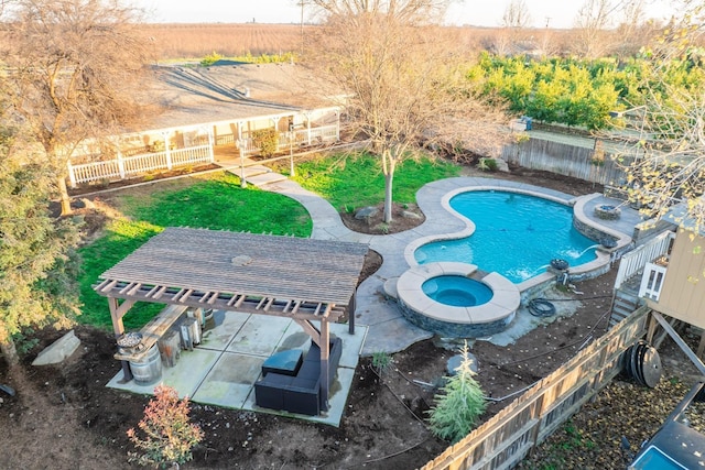 view of pool featuring a patio area and an in ground hot tub