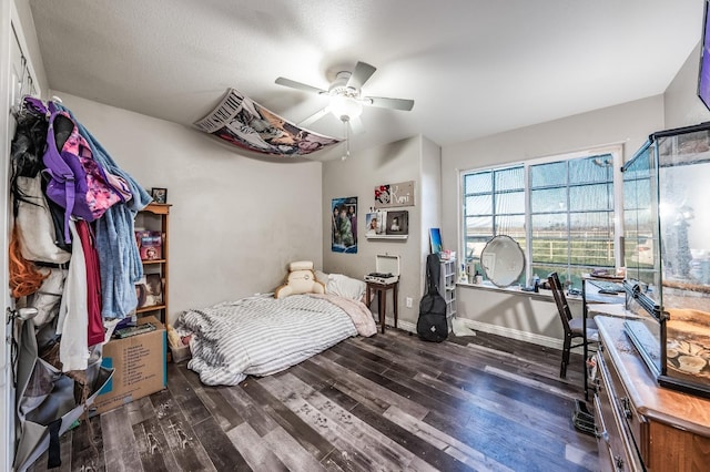 bedroom featuring dark hardwood / wood-style floors and ceiling fan